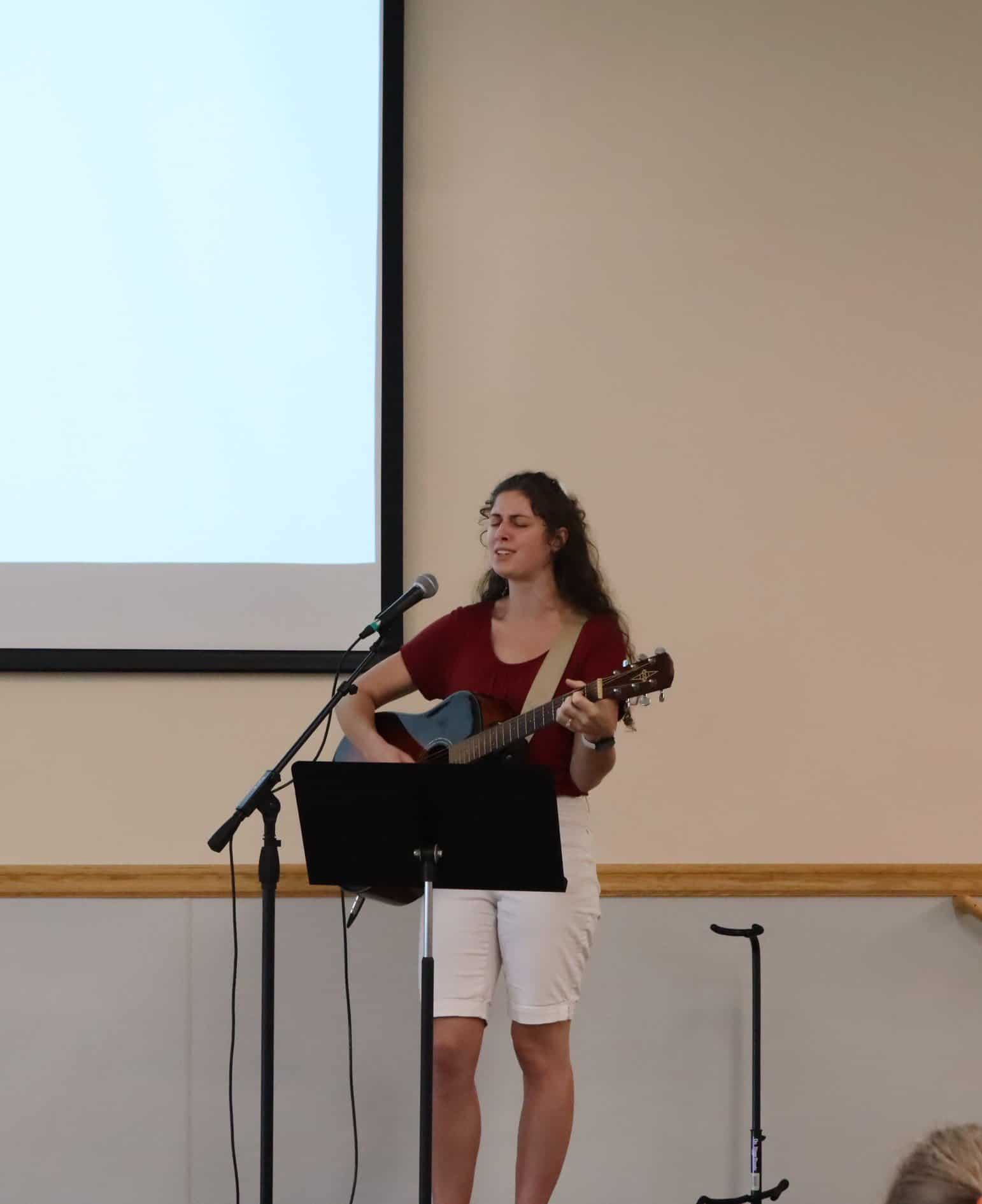 M.C. Beth Rasmussen welcomes guests to a Blessed Hope event. 